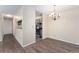 Bright dining area with hardwood floors and a stylish chandelier at 3600 S Pierce St # 5-101, Denver, CO 80235
