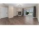 Cozy living room with a stone fireplace and sliding glass doors for natural light at 3600 S Pierce St # 5-101, Denver, CO 80235