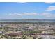 Sweeping aerial view captures the expansive cityscape and mountain views on a sunny day at 1020 15Th St # 42A, Denver, CO 80202