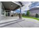 Spacious covered back patio with stone accents, recessed lights, and access to a lush, landscaped backyard at 11821 Discovery Ln, Parker, CO 80138