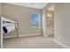 Bedroom with a carpeted floor and a bunkbed and a view into the en suite bathroom at 11821 Discovery Ln, Parker, CO 80138