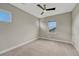 Bedroom featuring carpet flooring, neutral paint, and two well lit windows at 11821 Discovery Ln, Parker, CO 80138