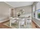 Bright dining room with modern decor, a glass-top table and stylish chairs at 11821 Discovery Ln, Parker, CO 80138