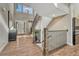 Stunning foyer featuring a staircase with wooden and wrought iron elements and hardwood floors at 11821 Discovery Ln, Parker, CO 80138
