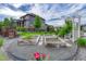 Landscaped garden area with raised garden beds, decorative gravel, flowers, and view of home exterior at 11821 Discovery Ln, Parker, CO 80138
