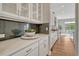 Elegant kitchen featuring white cabinets, subway tile backsplash, and granite counters at 11821 Discovery Ln, Parker, CO 80138