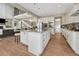 Large kitchen island offering seating, storage, and views into the adjacent living spaces at 11821 Discovery Ln, Parker, CO 80138