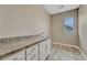 Laundry room with cabinets, countertops, and tiled floor at 11821 Discovery Ln, Parker, CO 80138