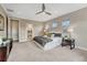 Spacious main bedroom with plush carpet, neutral colors, and en-suite bath access at 11821 Discovery Ln, Parker, CO 80138