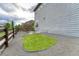 Landscaped side yard with an island of turf, gravel, and a wooden fence at 11821 Discovery Ln, Parker, CO 80138
