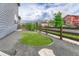 Low-maintenance side yard with a turf area and gravel, bordered by a wooden fence at 11821 Discovery Ln, Parker, CO 80138