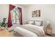 Bright bedroom with a queen bed, window, and wood flooring at 561 Cherokee St, Denver, CO 80204