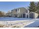 Backyard with storage sheds and snow-covered ground at 11914 Bellaire Cir, Thornton, CO 80233