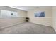 Finished basement with neutral carpeting and ample space at 11914 Bellaire Cir, Thornton, CO 80233