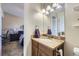 Bathroom with vanity and a view of the bedroom at 11914 Bellaire Cir, Thornton, CO 80233