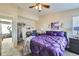 Bright bedroom with a queen bed and en-suite bathroom at 11914 Bellaire Cir, Thornton, CO 80233