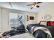 Bedroom with elliptical machine and plenty of natural light at 11914 Bellaire Cir, Thornton, CO 80233