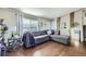 Living room with gray sectional sofa and hardwood floors at 11914 Bellaire Cir, Thornton, CO 80233