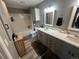 Modern bathroom with double sinks, vanity, and tub-shower, designed for both style and practicality at 2111 Enterprise St, Superior, CO 80027