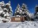 Saddle Brooke entrance sign in the snow at 2111 Enterprise St, Superior, CO 80027