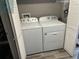 Convenient laundry area with a modern white washer and dryer, maximizing space and functionality at 2111 Enterprise St, Superior, CO 80027