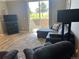Comfortable living room featuring a plush sofa, carpet, and natural light from the sliding glass doors at 2111 Enterprise St, Superior, CO 80027