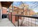 Balcony view of building exterior, street and a car parked along the curb at 5401 S Park Terrace Ave # 105A, Greenwood Village, CO 80111