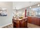Open concept kitchen with an island counter that looks into living room area at 5401 S Park Terrace Ave # 105A, Greenwood Village, CO 80111