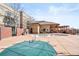 Community pool with lounge area, tables, and covered patio at 5401 S Park Terrace Ave # 105A, Greenwood Village, CO 80111