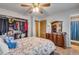 Spacious bedroom with closet, mirror, and an attached bathroom, providing a comfortable personal space at 15628 E Girard Pl, Aurora, CO 80013