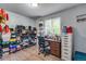 Versatile room with a desk and a large window, suitable for bedroom, home office, or dressing area at 15628 E Girard Pl, Aurora, CO 80013