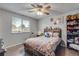 Cozy bedroom featuring a comfortable bed, side table, and window, creating a personal retreat space at 15628 E Girard Pl, Aurora, CO 80013