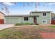Charming two-story home with a well-maintained front yard and an attached garage, perfect for suburban living at 15628 E Girard Pl, Aurora, CO 80013