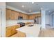 Eat-in kitchen with stainless steel appliances, island, and bright countertops at 21292 E 63Rd Dr, Aurora, CO 80019