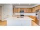 Kitchen with a center island, stainless steel appliances, and wood cabinets at 21292 E 63Rd Dr, Aurora, CO 80019