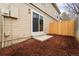 Small backyard features a sliding glass door from the home to a patio area at 1545 S Ouray Cir # A, Aurora, CO 80017
