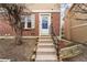 Inviting entrance with stairs leading to the front door of this brick townhome at 1545 S Ouray Cir # A, Aurora, CO 80017