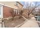 Lovely brick townhome exterior with manicured landscaping and convenient parking at 1545 S Ouray Cir # A, Aurora, CO 80017