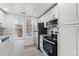 Contemporary kitchen showcasing stainless steel appliances and ample counter space at 1545 S Ouray Cir # A, Aurora, CO 80017
