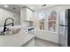 Stylish kitchen with sleek countertops, updated appliances, and double windows at 1545 S Ouray Cir # A, Aurora, CO 80017