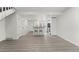 Spacious living room with wood floors, a cozy breakfast bar, and an adjacent kitchen at 1545 S Ouray Cir # A, Aurora, CO 80017