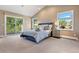 Bright bedroom with vaulted ceilings, natural light, and private balcony access at 1621 Baneberry Ln, Golden, CO 80401
