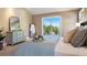 Serene bedroom with sliding door to balcony offering beautiful views of the trees and mountains at 1621 Baneberry Ln, Golden, CO 80401