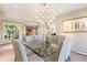 Elegant dining room with modern light fixture and scenic views at 1621 Baneberry Ln, Golden, CO 80401