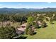 Expansive home with a three-car garage is surrounded by mature trees and offers stunning mountain views at 1621 Baneberry Ln, Golden, CO 80401