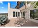 Exterior of home with a patio, mountain views, and lush landscaping at 1621 Baneberry Ln, Golden, CO 80401