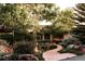 A stone path leads to this home with lush landscaping and an inviting entryway at 1621 Baneberry Ln, Golden, CO 80401