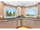Modern kitchen with stainless steel appliances, under cabinet lighting, and beautiful views at 1621 Baneberry Ln, Golden, CO 80401