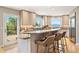 Contemporary kitchen with breakfast bar, granite countertops, and scenic views from windows at 1621 Baneberry Ln, Golden, CO 80401