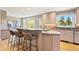 Modern kitchen features breakfast bar, sleek countertops, and natural light from outdoor views at 1621 Baneberry Ln, Golden, CO 80401